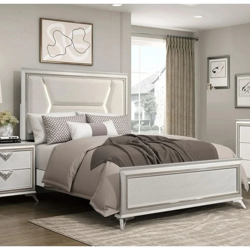 Wooden bedroom furniture with an antique white finish and gold accents, a modern luxury queen bed with an upholstered headboard and LED lighting