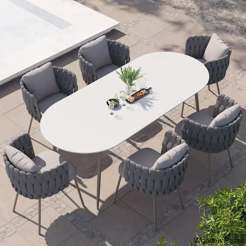 Delsie 6 seater Oval Faux Marble Outdoor Dining Set with Rope Woven Armchairs